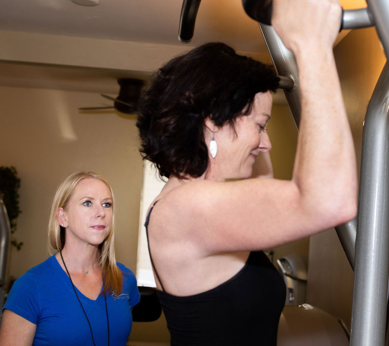 E Studio trainer Kendell guides client Cheryl through a slow-tempo set.