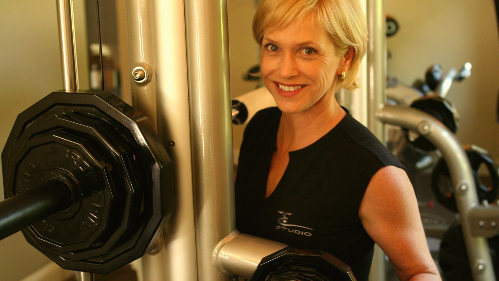 A trainer guides a client through a SuperSlow set.